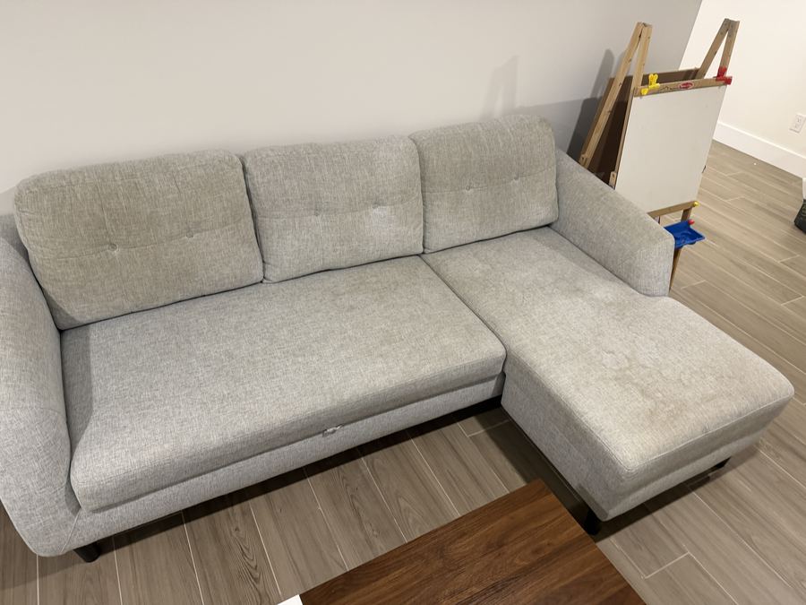 Light grey chaise sectional before sofa cleaning in Essex County NJ